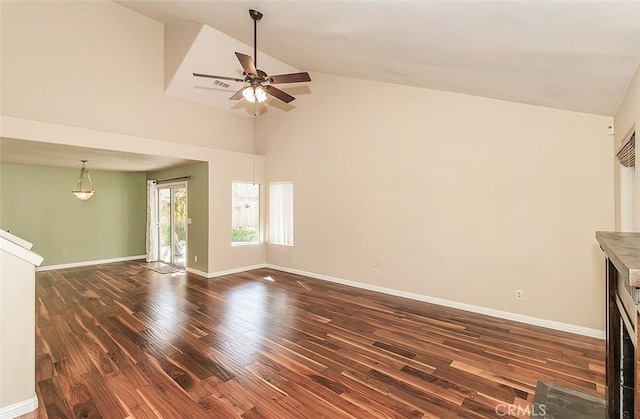 unfurnished living room featuring ceiling fan, dark hardwood / wood-style floors, and high vaulted ceiling