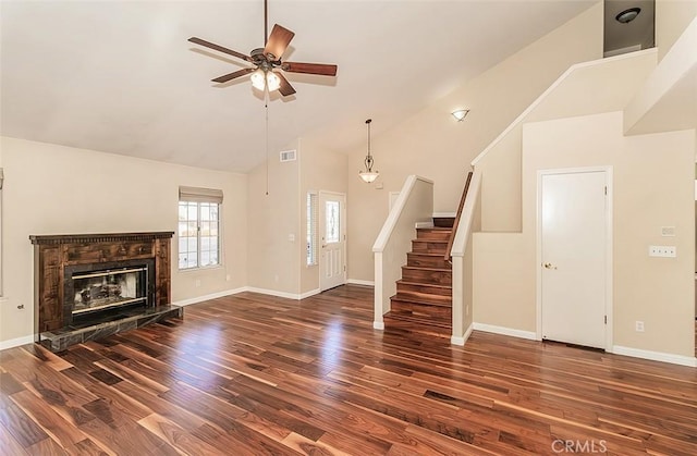 unfurnished living room featuring high vaulted ceiling, dark wood-type flooring, and ceiling fan