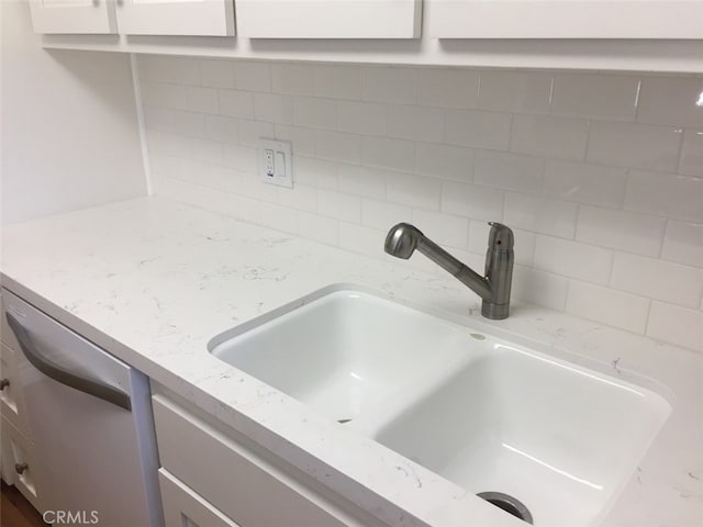 interior details featuring sink and stainless steel dishwasher