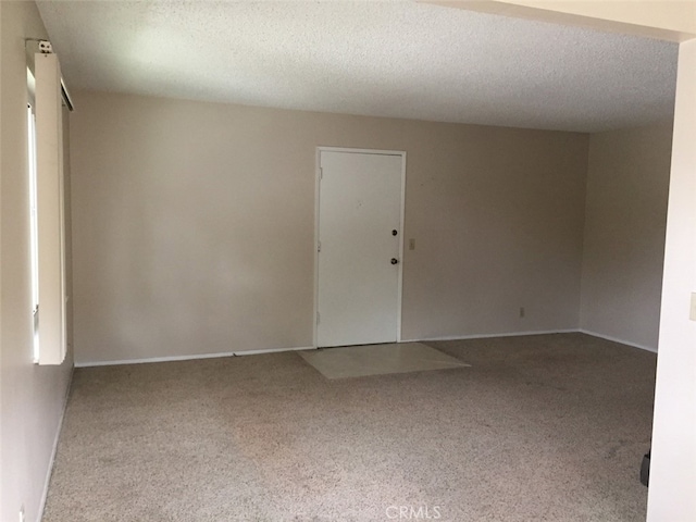 empty room featuring a textured ceiling