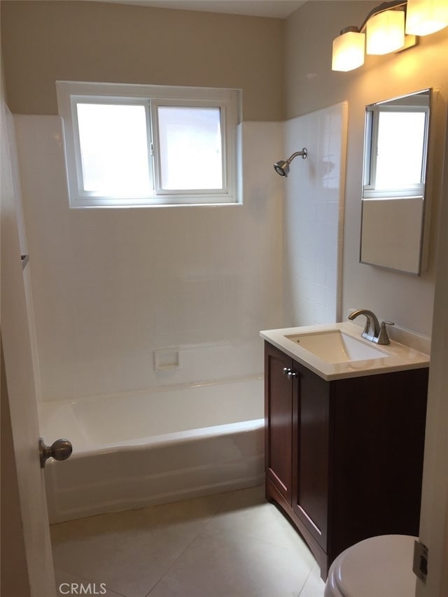 full bathroom featuring tile patterned flooring, vanity, a healthy amount of sunlight, and toilet