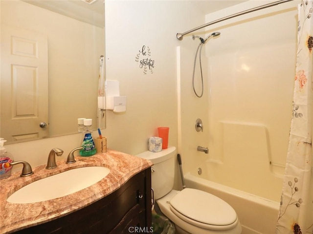 full bathroom with vanity, shower / bath combo, and toilet