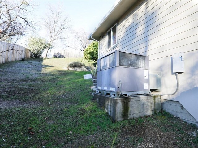 view of side of property with a lawn