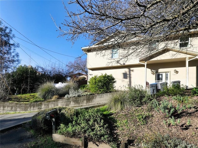 view of side of property featuring stucco siding