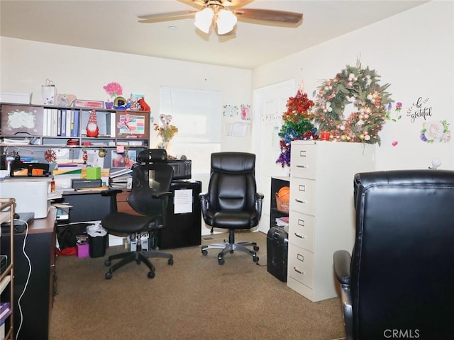 home office with ceiling fan and carpet flooring