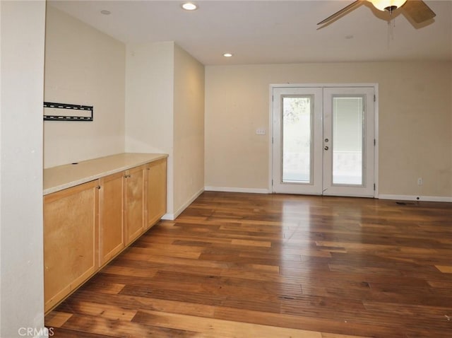 interior space with recessed lighting, french doors, baseboards, and wood finished floors