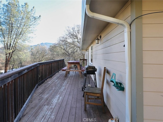 wooden terrace featuring a mountain view