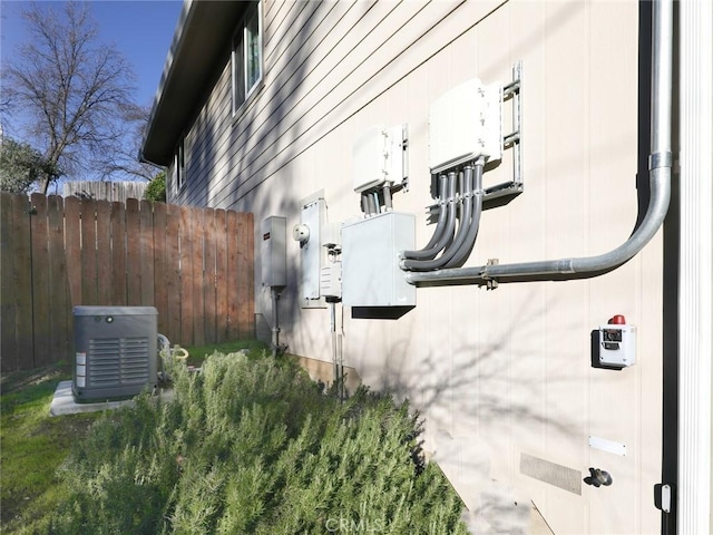 view of home's exterior with fence