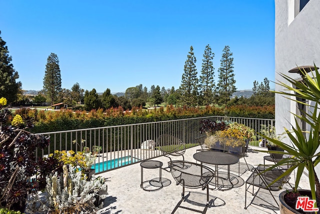 view of patio / terrace featuring a fenced in pool