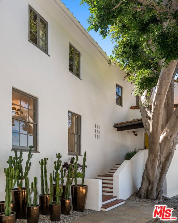 view of side of property with a patio area