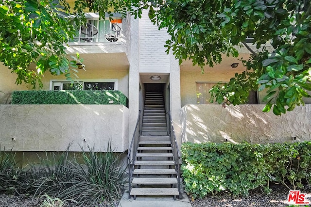 doorway to property featuring a balcony