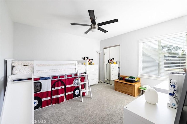 bedroom with ceiling fan and light carpet