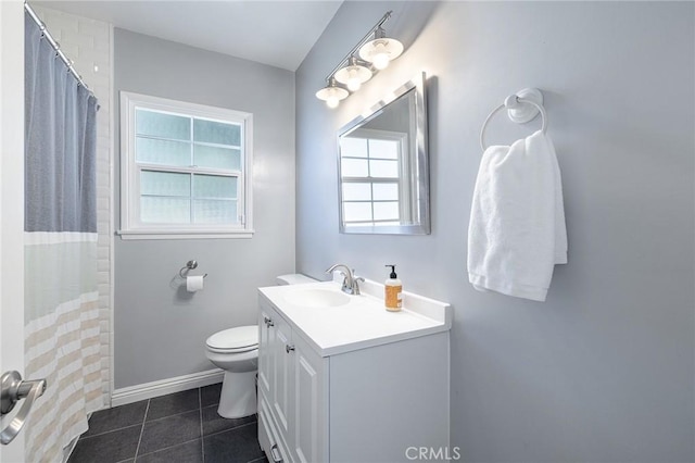 bathroom with walk in shower, tile patterned floors, vanity, and toilet