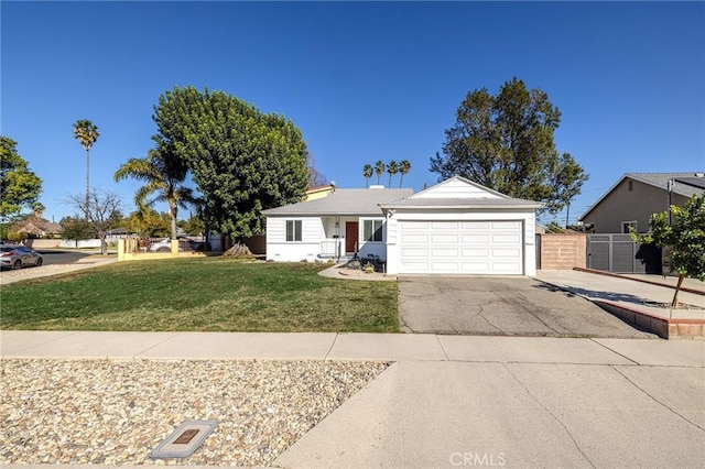 view of front of home featuring a garage and a front yard