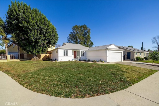 ranch-style home with a garage and a front yard