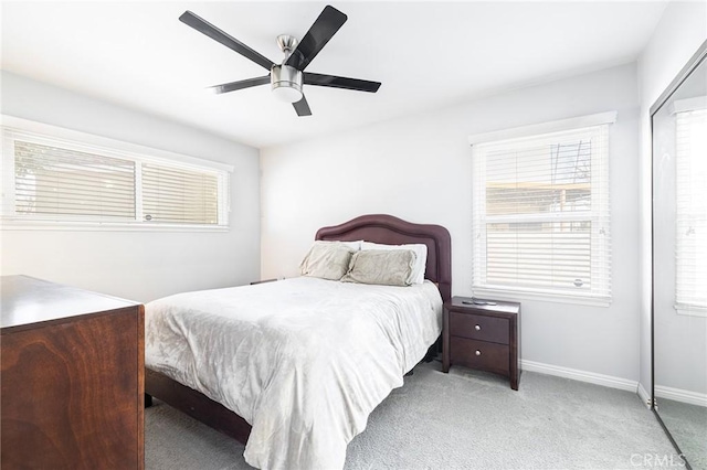 bedroom with light colored carpet and ceiling fan