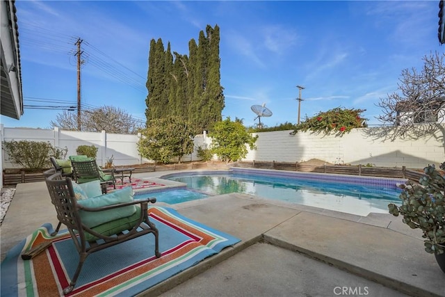 view of swimming pool featuring a patio area