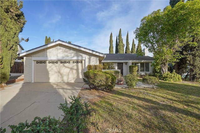 single story home with a garage and a front lawn