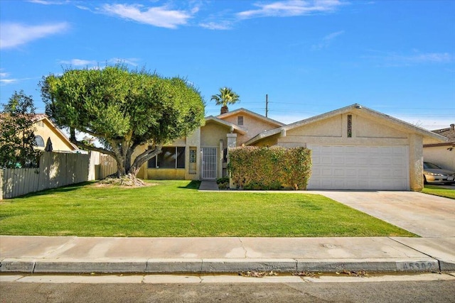 single story home with a garage and a front lawn