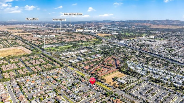 birds eye view of property featuring a mountain view