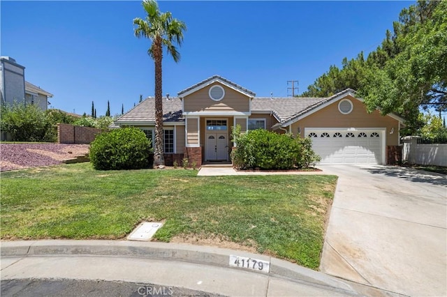 view of front of home with a garage and a front yard