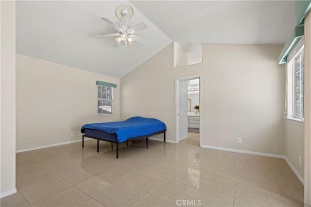 tiled bedroom featuring vaulted ceiling and ceiling fan