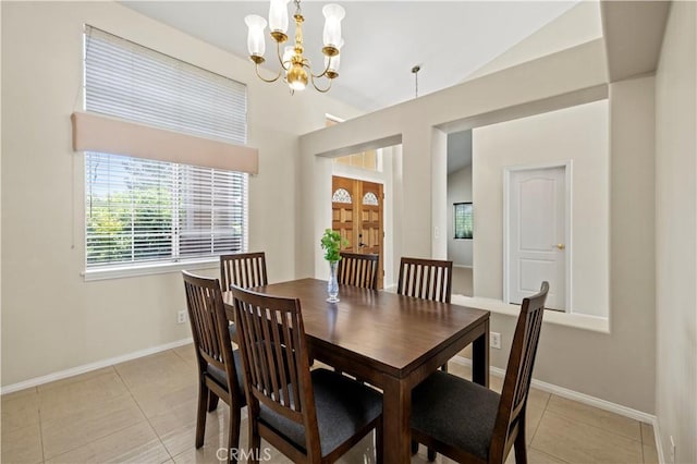 tiled dining area featuring vaulted ceiling and a chandelier