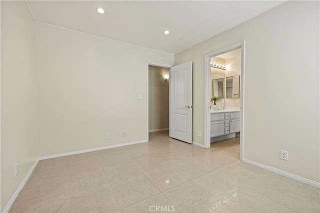 unfurnished bedroom featuring ensuite bath