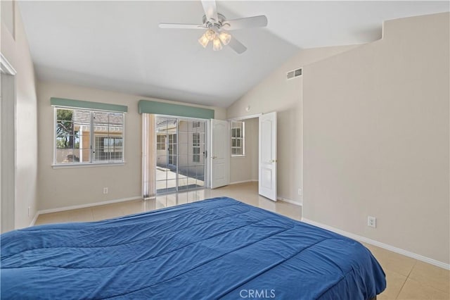 bedroom featuring ceiling fan, vaulted ceiling, and light tile patterned floors