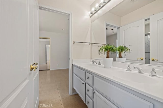 bathroom featuring tile patterned flooring and vanity