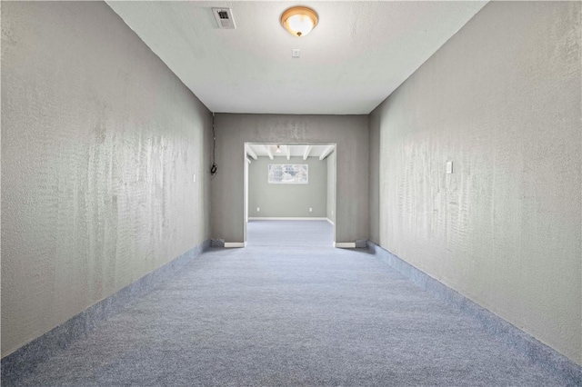 corridor featuring carpet flooring