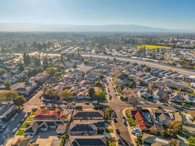 drone / aerial view featuring a mountain view