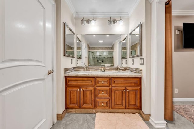 bathroom with vanity, crown molding, and a shower with door