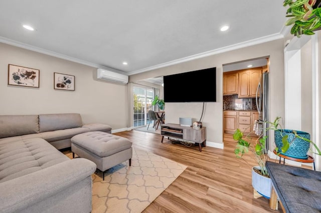 living room with ornamental molding, an AC wall unit, and light hardwood / wood-style floors