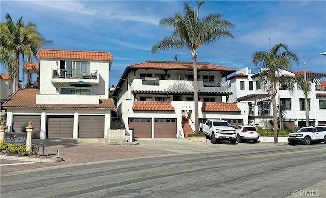 mediterranean / spanish house with a garage