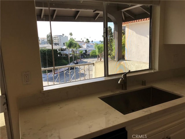 kitchen with sink and a wealth of natural light