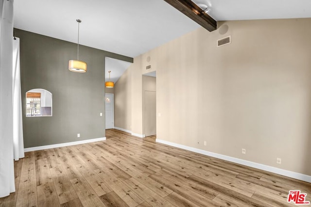 unfurnished living room with beam ceiling, high vaulted ceiling, and light wood-type flooring