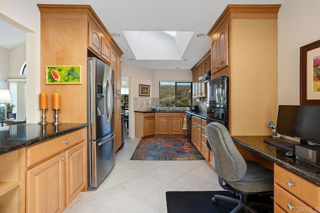 kitchen featuring stainless steel refrigerator with ice dispenser, dishwasher, dark stone countertops, and kitchen peninsula