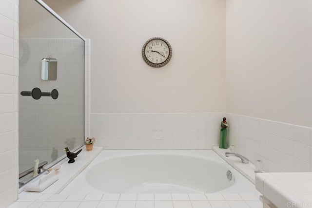 bathroom featuring a relaxing tiled tub