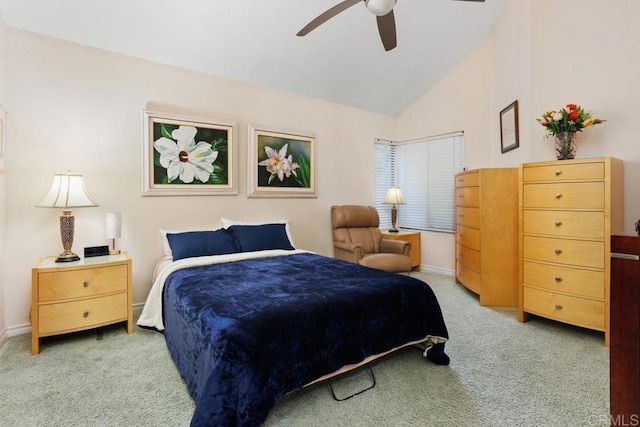 carpeted bedroom featuring ceiling fan and vaulted ceiling