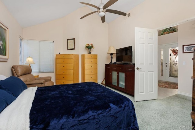 carpeted bedroom featuring lofted ceiling and ceiling fan