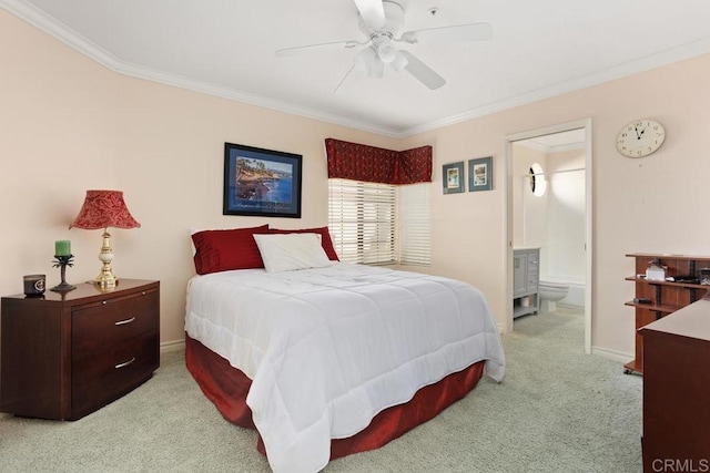 bedroom featuring light carpet, connected bathroom, ornamental molding, and ceiling fan