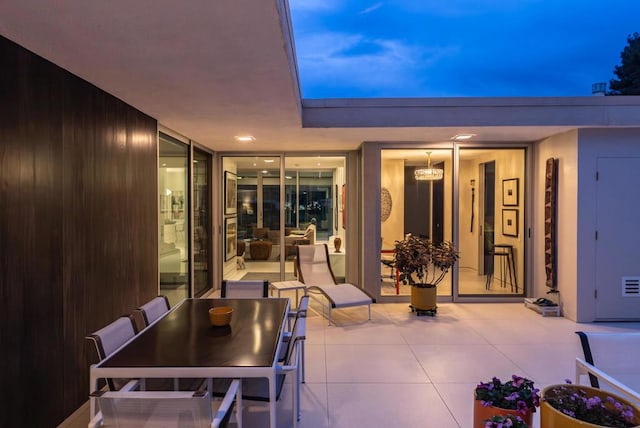 view of patio terrace at dusk