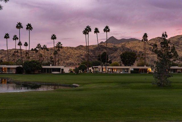 view of home's community featuring a yard and a water and mountain view