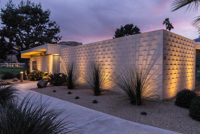 view of property exterior at dusk