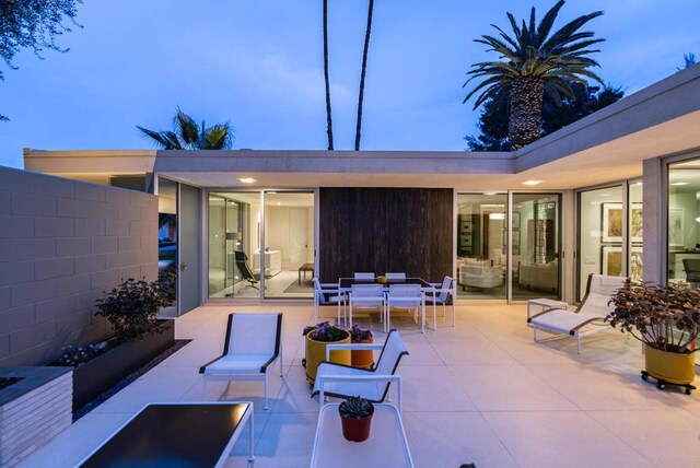 view of patio terrace at dusk