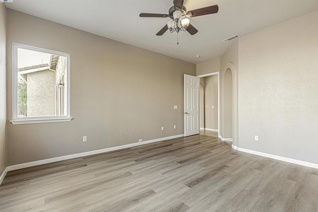 spare room featuring ceiling fan and light hardwood / wood-style floors