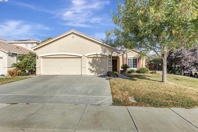 single story home with a garage and a front yard