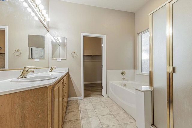 bathroom with vanity, shower with separate bathtub, and tile patterned flooring