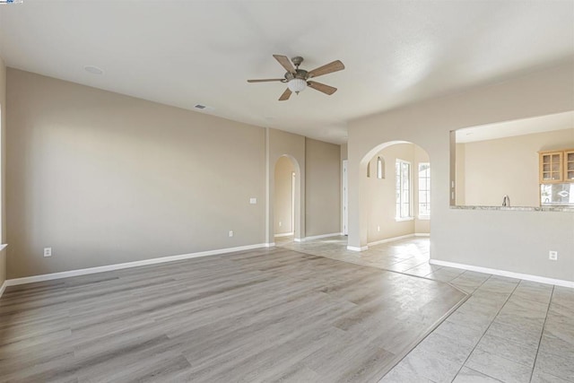 spare room with ceiling fan and light hardwood / wood-style flooring